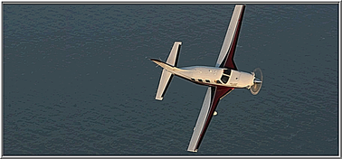 A compelling view of the PA46-500T Piper Meridian over the water                                     from above